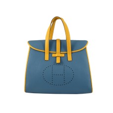 Sac à rabat Hermès 08c bleu avec garniture en cuir jaune