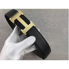 Boucle de ceinture Hermès en or H et bracelet réversible en cuir noir