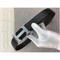 Boucle de ceinture Hermès argentée en forme de H et bracelet réversible en cuir noir